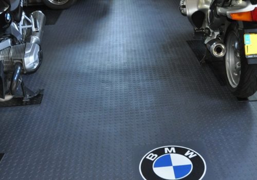 Studded Flexi-Tile floor with motorbikes