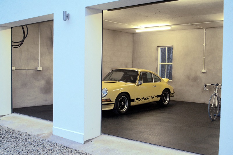 modern garage with a Porsche parked on a Flexi-Tile floor
