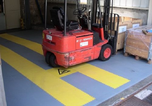 Grey and yellow Flexi-Tile floor in a factory warehouse