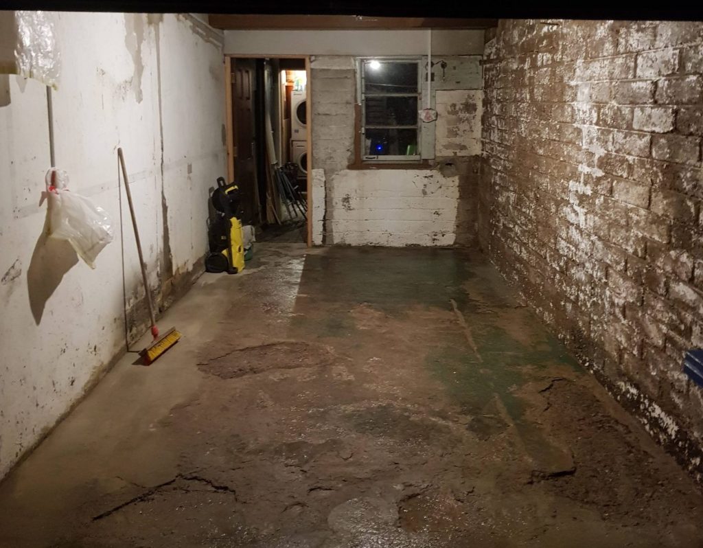 Empty garage with cracked concrete floor