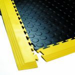 Close up of a studded Flexi-Tile with yellow ramps